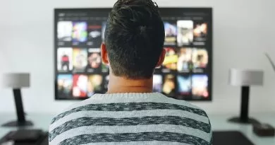 A person standing in front of a screen